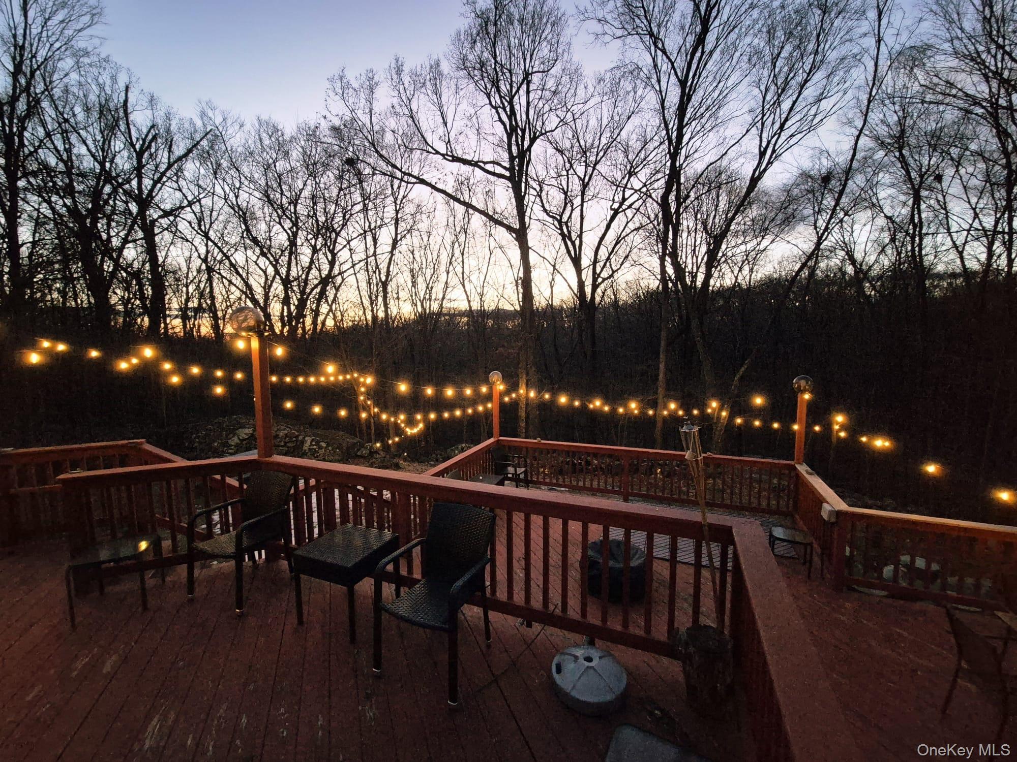 17 Birch Hill Road Putnam Valley, NY 10579 - Photo 9 of 24 a view of a roof deck with table and chairs a barbeque with wooden floor and fence