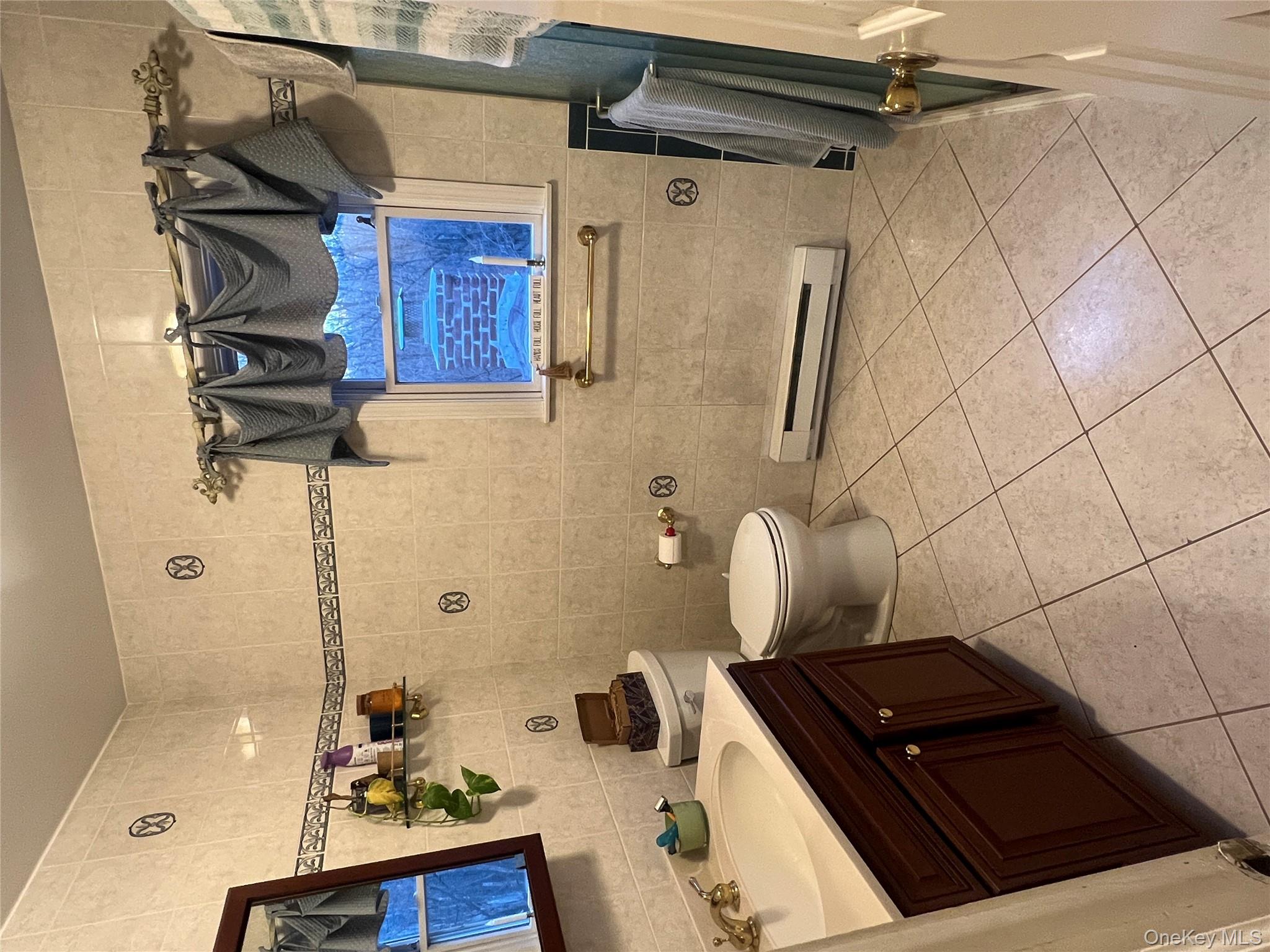 17 Birch Hill Road Putnam Valley, NY 10579 - Photo 10 of 24 a bathroom with a sink and a mirror