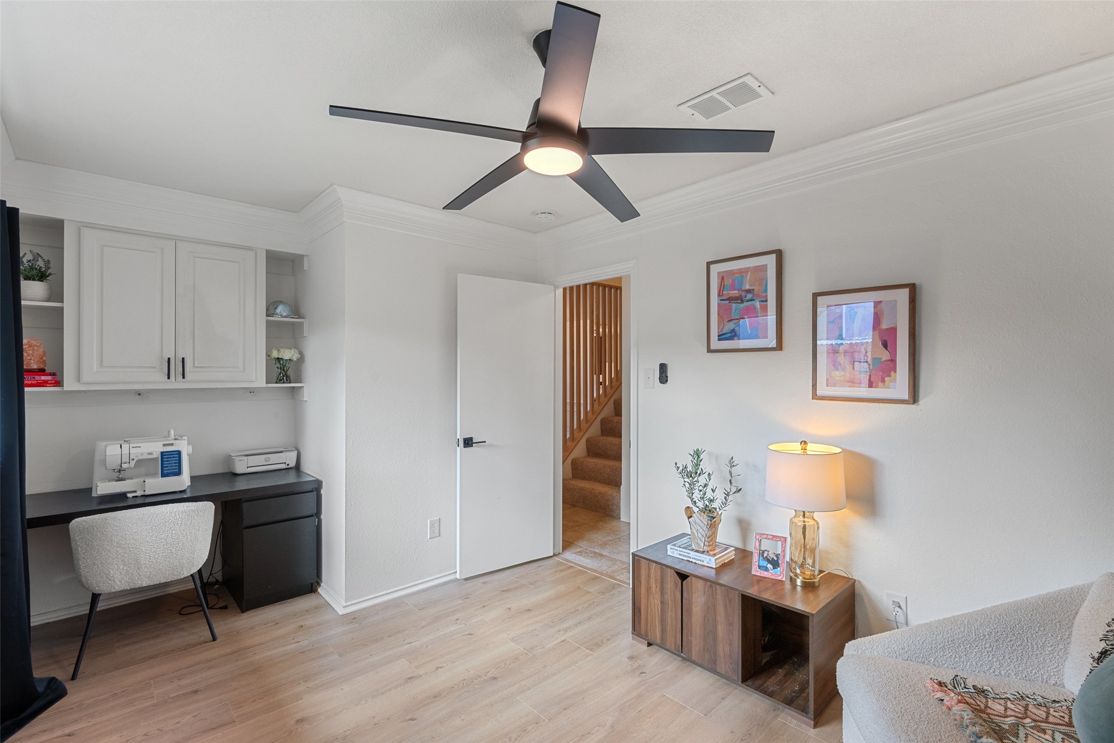 9833 Briar Ridge Drive Austin, TX 78748 - Photo 22 of 29 Office space with built in desk, light wood-style floors, crown molding, and a ceiling fan