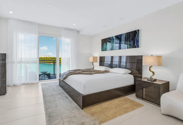 a bedroom with a bed and a couch