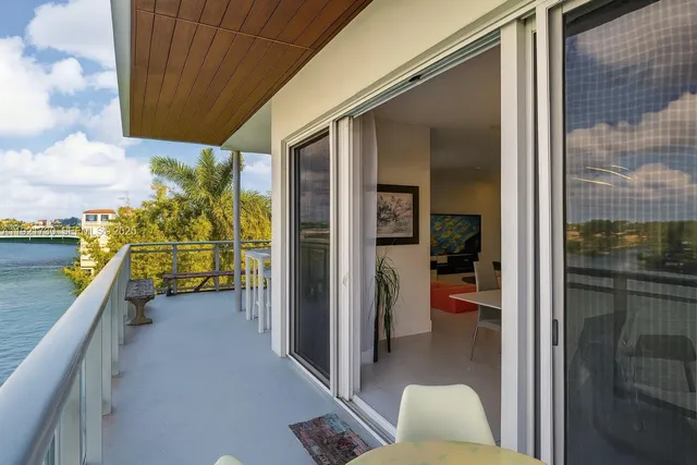 a kitchen with a table and chairs in it