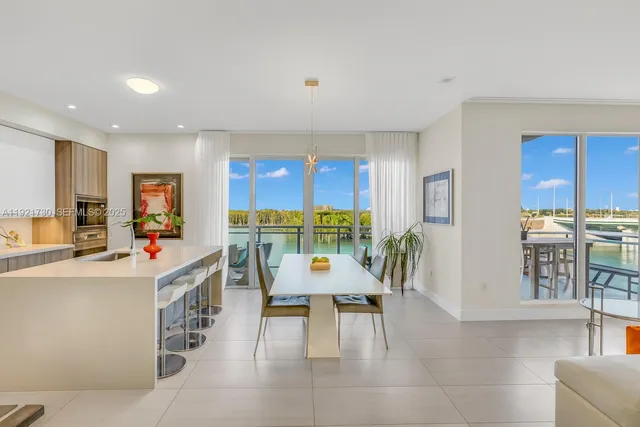 a view of a living room kitchen and dining room