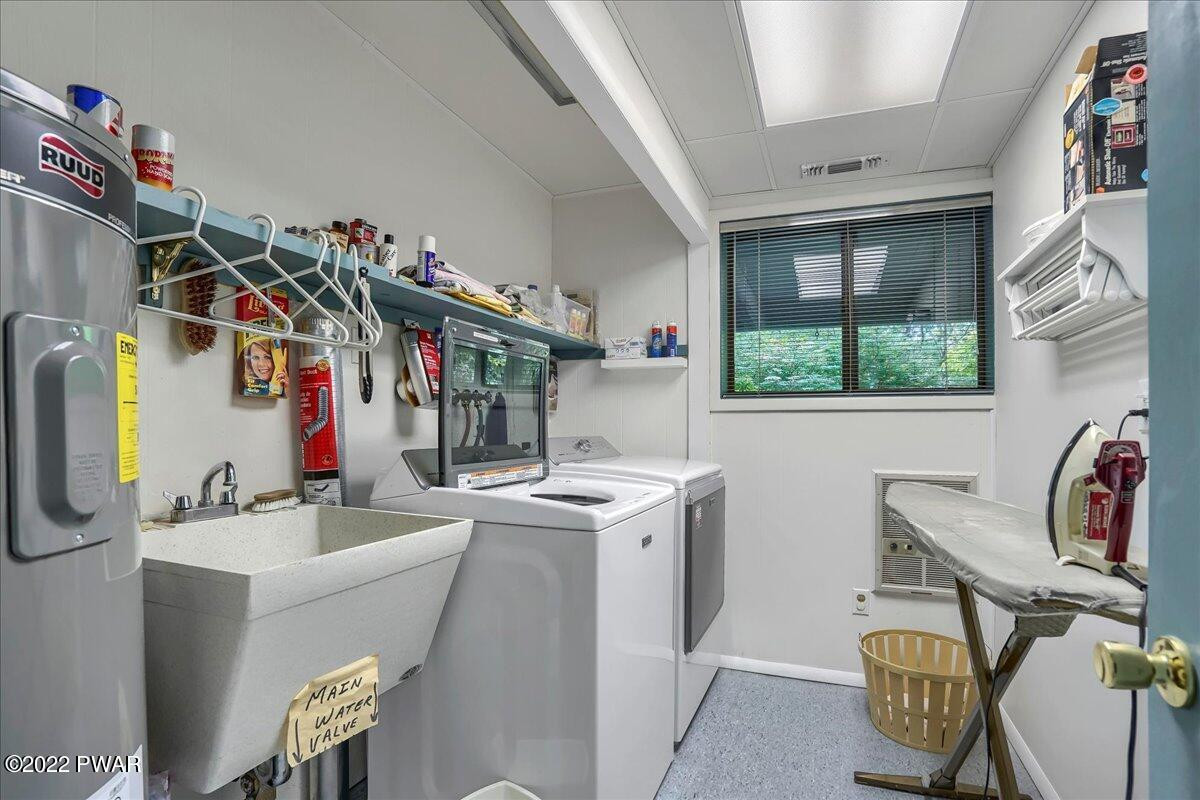 110 Ridge Road Hawley, PA 18428 - Photo 33 of 49 a view of a storage and utility room with washer and dryer