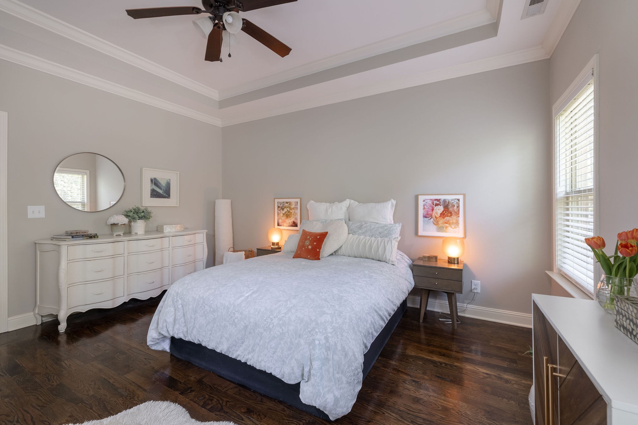 7113 Rusty Drive Fairview, TN 37062 - Photo 28 of 67 a bedroom with a bed a mirror on dresser and a chandelier