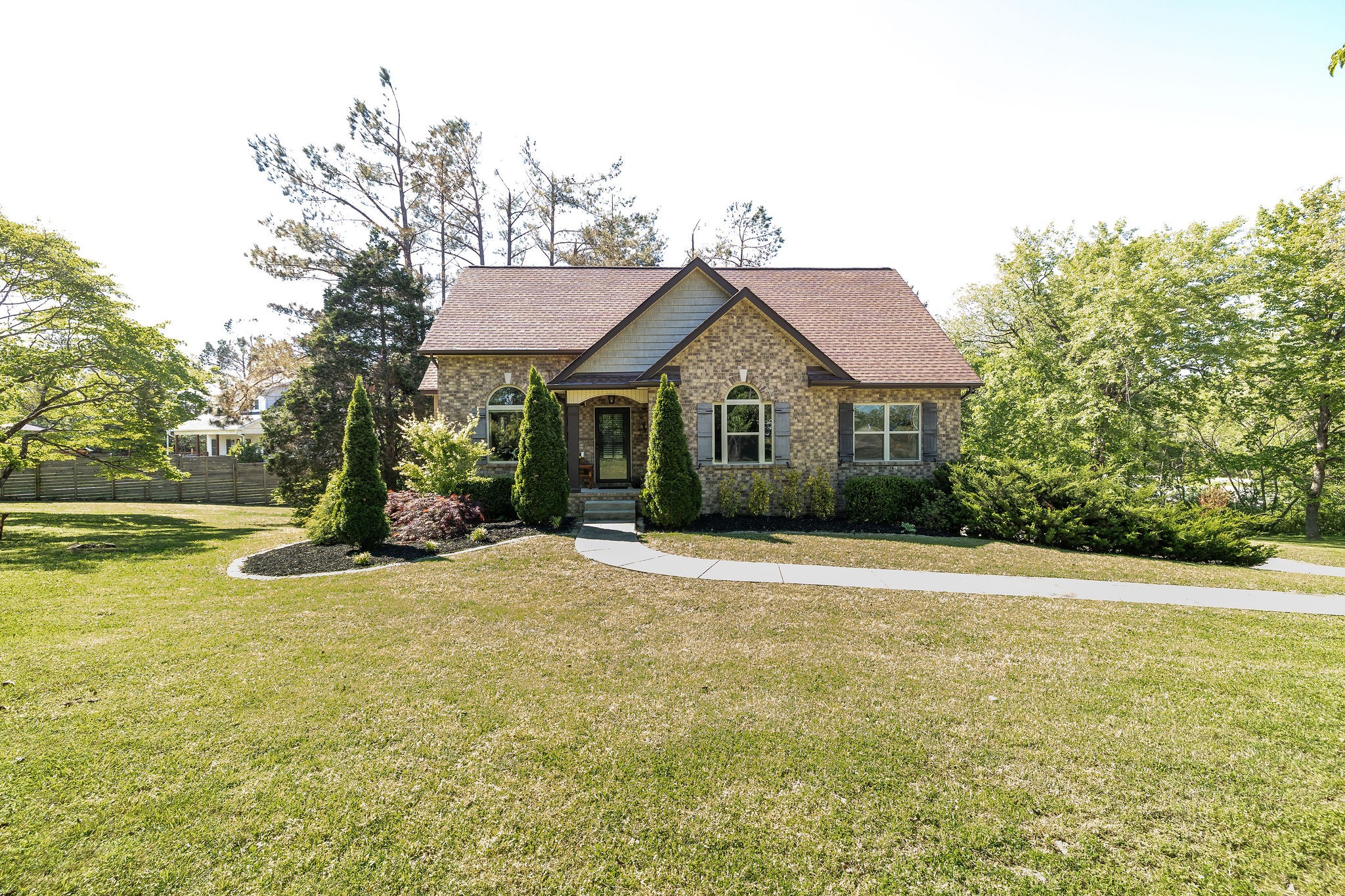 7113 Rusty Drive Fairview, TN 37062 - Photo 3 of 67 a front view of a house with a garden