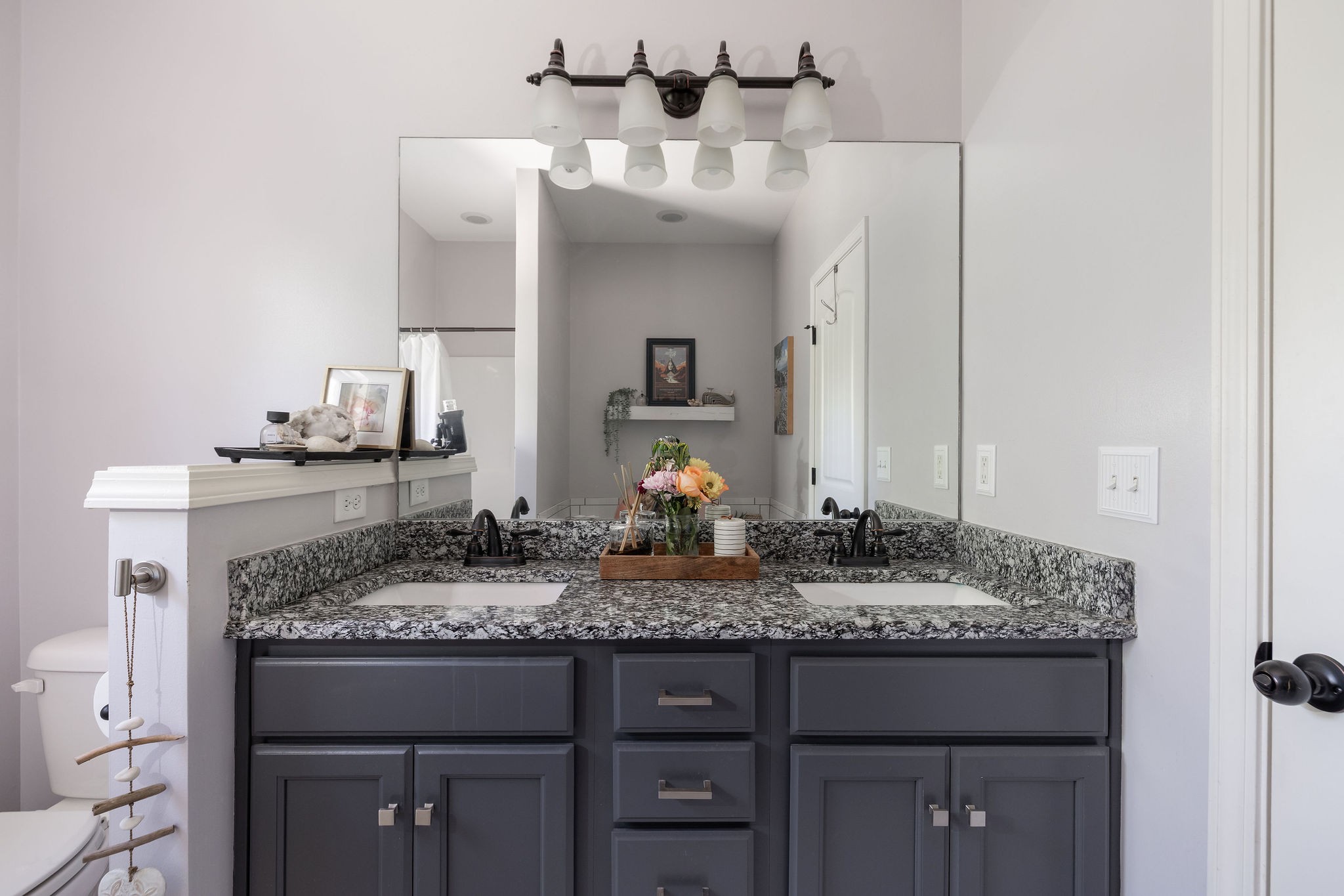 7113 Rusty Drive Fairview, TN 37062 - Photo 32 of 67 a bathroom with a granite countertop sink and a mirror