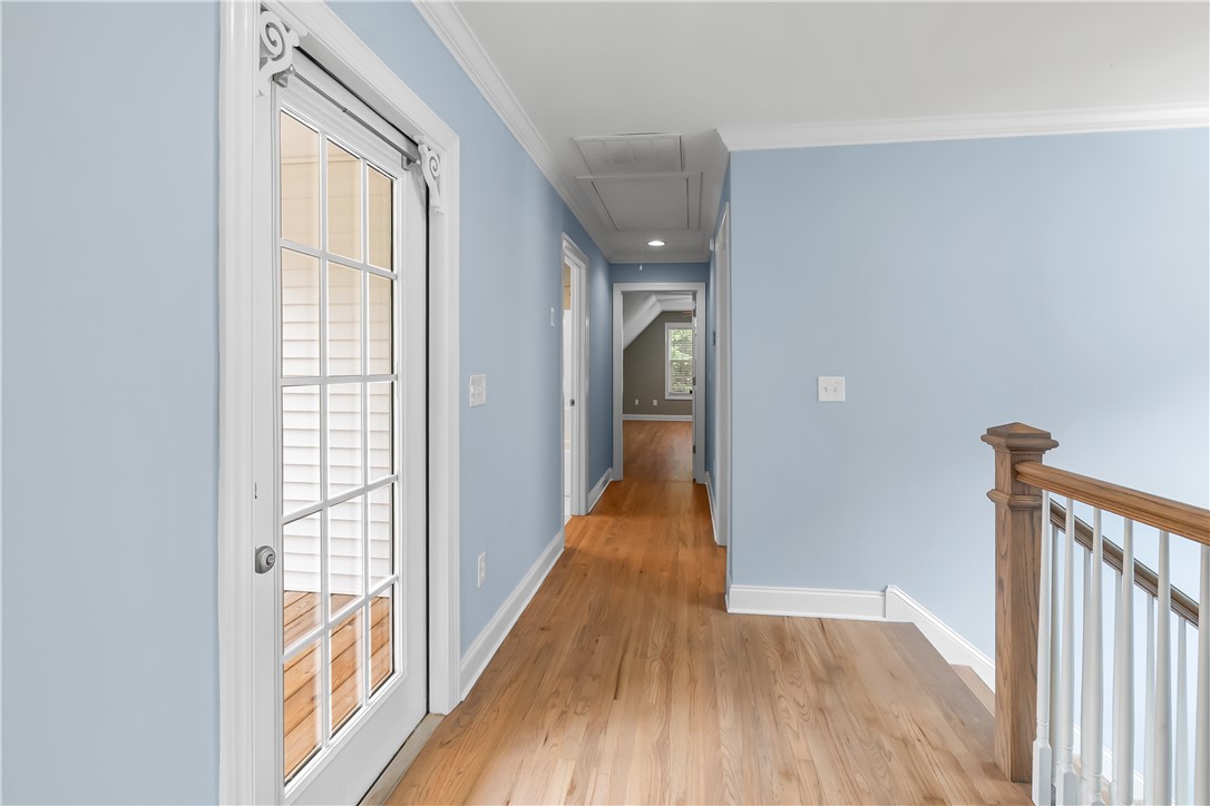 206 Village Way Pendleton, SC 29670 - Photo 24 of 46 A graceful hallway with natural oak wood flooring leads to further rooms, enhancing flow and light.