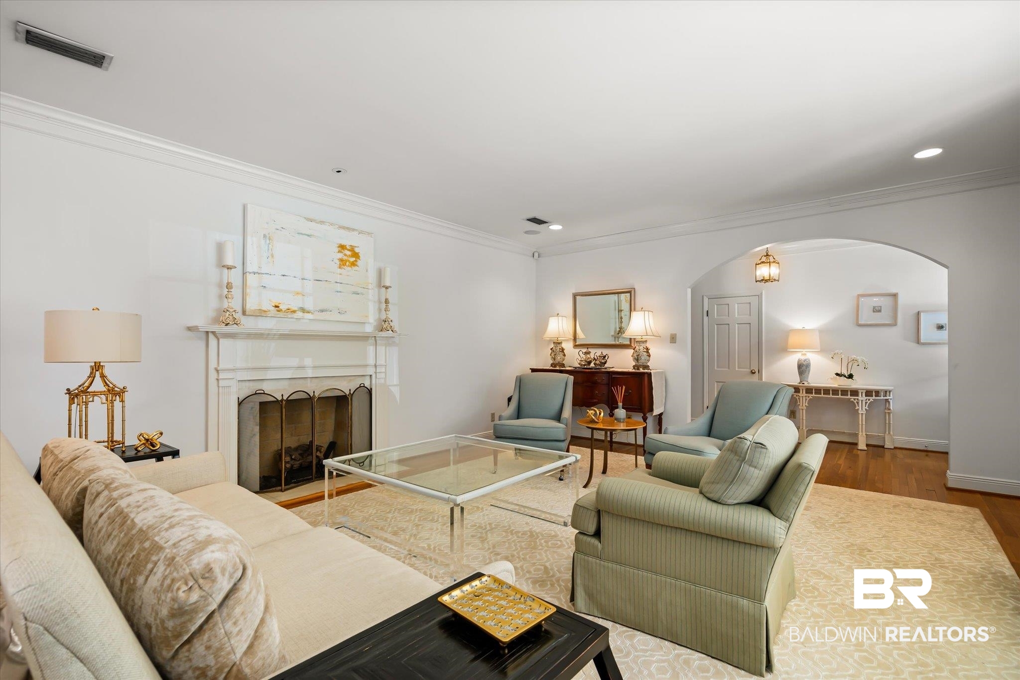 143 Myrtlewood Lane Mobile, AL 36608 - Photo 4 of 55 Living area with arched walkways, visible vents, crown molding, and wood finished floors