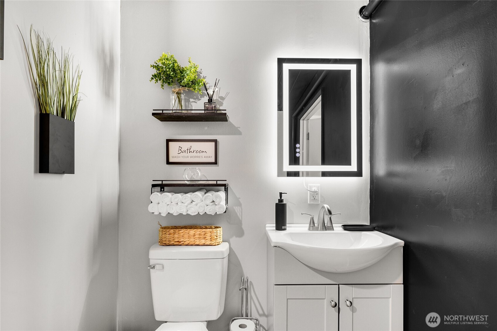 4515 Northeast 17th Place Renton, WA 98059 - Photo 24 of 36 a bathroom with a sink toilet and mirror