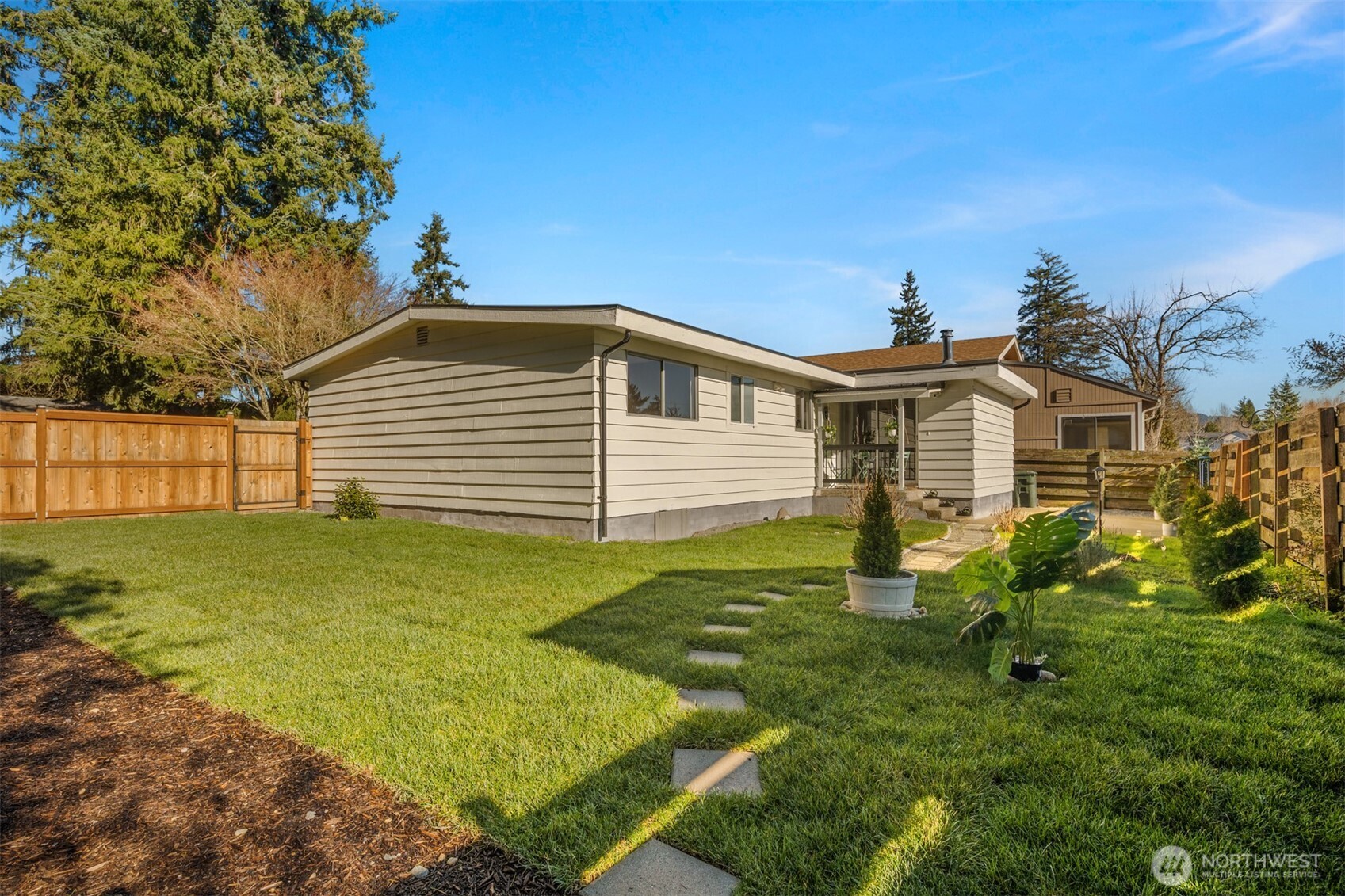 4515 Northeast 17th Place Renton, WA 98059 - Photo 29 of 36 a view of a house with a yard
