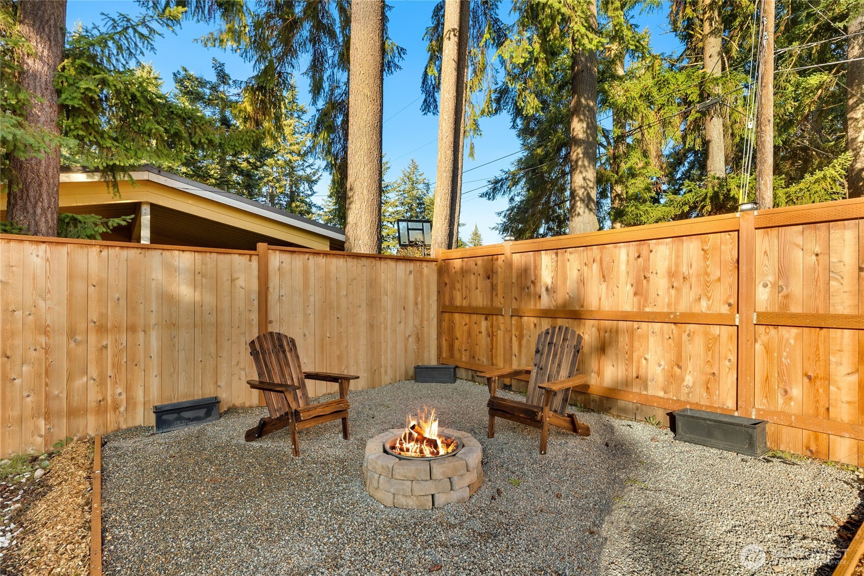 4515 Northeast 17th Place Renton, WA 98059 - Photo 31 of 36 a backyard of a house with table and chairs