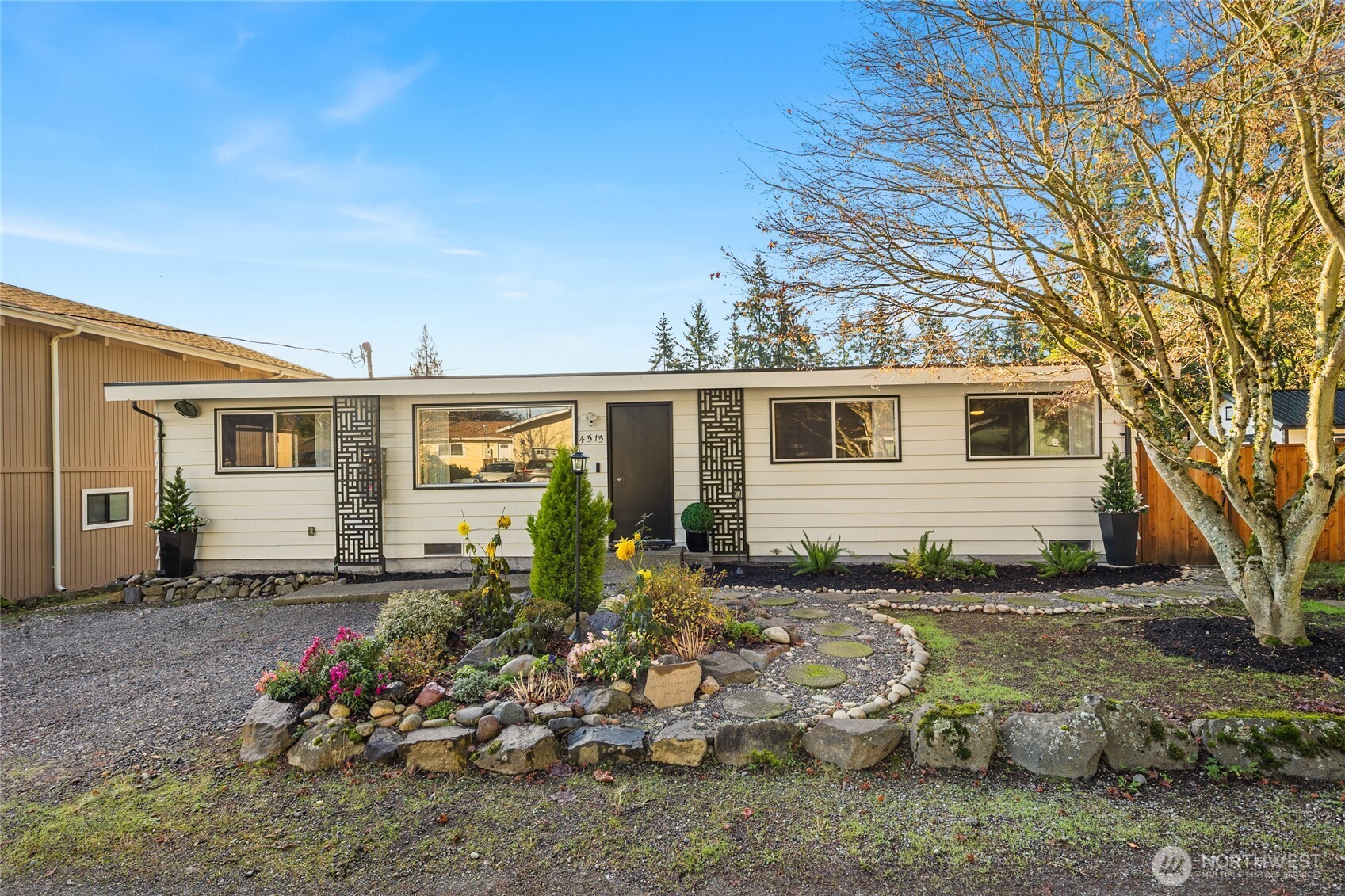4515 Northeast 17th Place Renton, WA 98059 - Photo 32 of 36 a view of a house with a yard