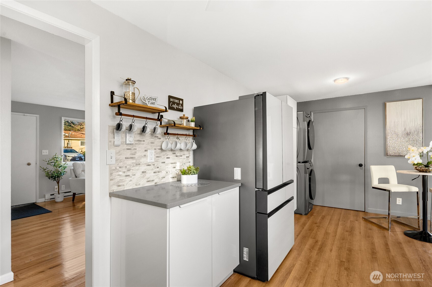 4515 Northeast 17th Place Renton, WA 98059 - Photo 10 of 36 a kitchen with stainless steel appliances a refrigerator and wooden floor