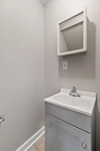 a bathroom with a sink and mirror
