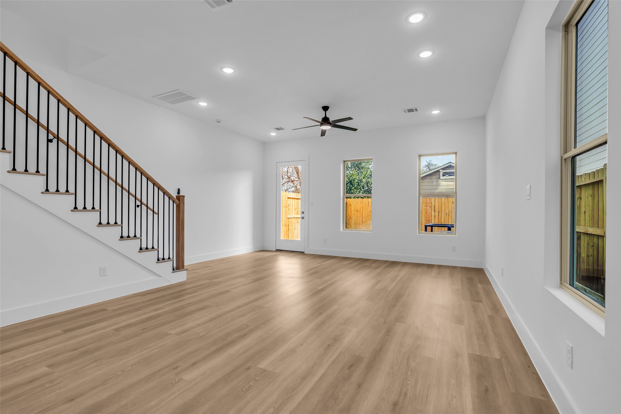 1506 Griffin Street Houston, TX 77009 - Photo 5 of 38 Energy Efficient vinyl windows, 9-10' ceilings and Durable Luxury Vinyl flooring throughout the home.
