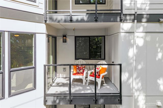 a kitchen with a refrigerator and table