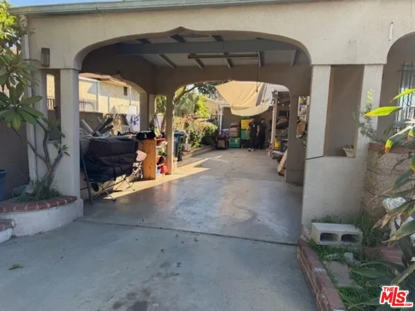 a view of garage with a table and chairs