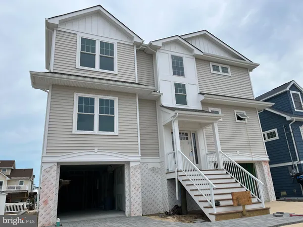 a front view of a house with stairs