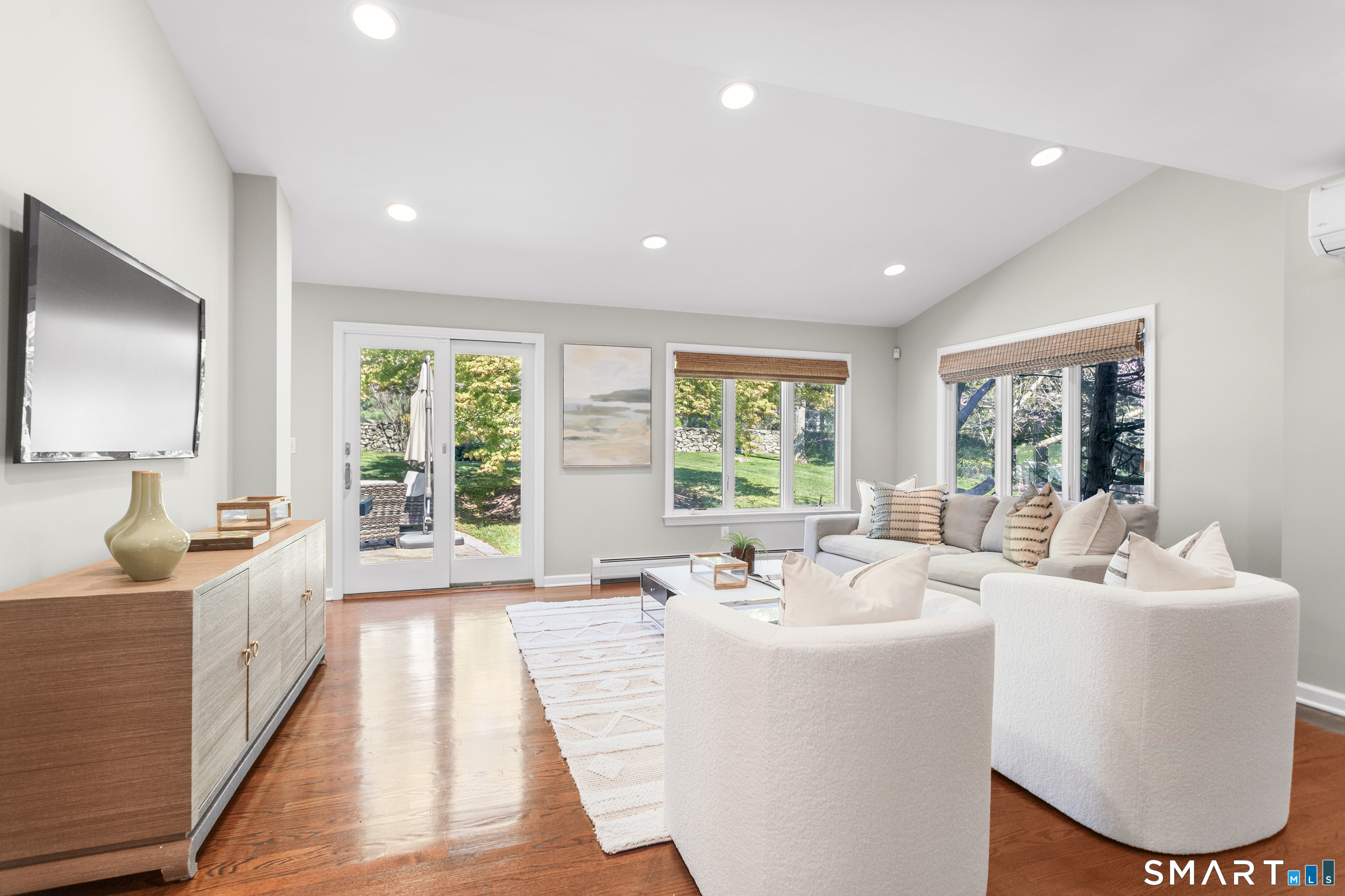 24 Burr School Road Westport, CT 06880 - Photo 14 of 40 Family room flows through sliders to back stone patio with BBQ