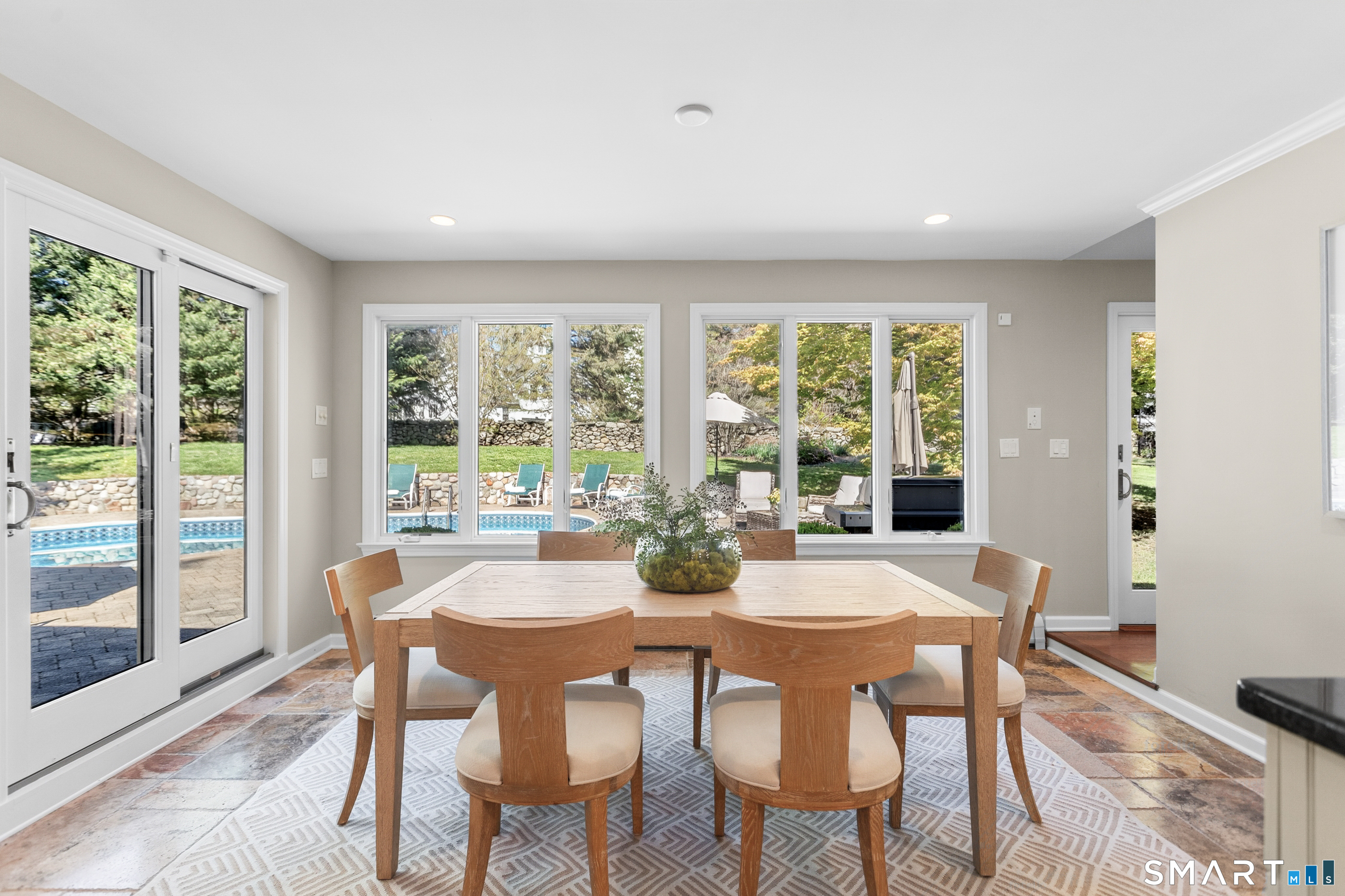 24 Burr School Road Westport, CT 06880 - Photo 21 of 40 This kitchen dining room brkigns the outside in...gorgeous stone floors