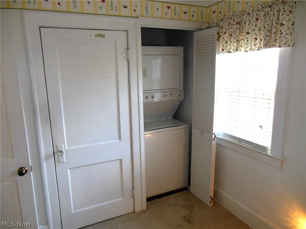 5963 Chapel Road Madison, OH 44057 - Photo 12 of 15 3rd Bedroom has stackable laundry hookup. Closed door leads to floored unfinished Attic.