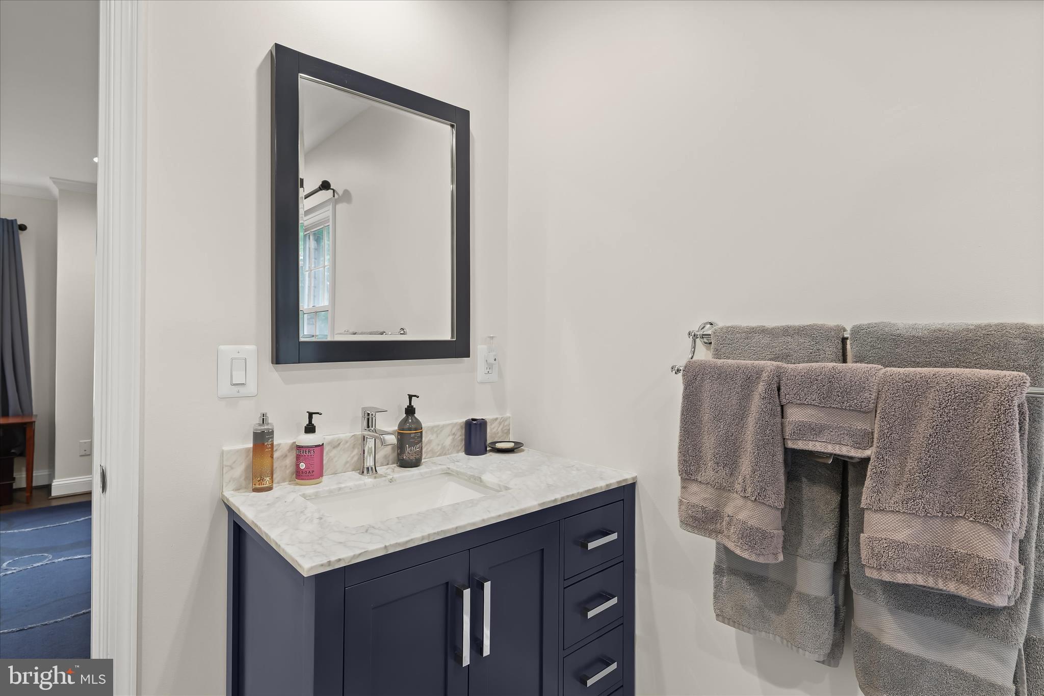 3754 Patuxent River Road Davidsonville, MD 21035 - Photo 24 of 82 a bathroom with a granite countertop sink and a mirror