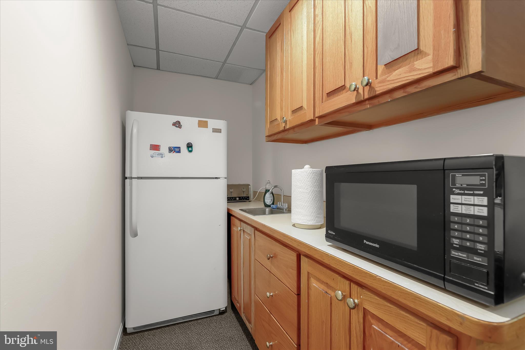 3754 Patuxent River Road Davidsonville, MD 21035 - Photo 36 of 82 a kitchen with stainless steel appliances a refrigerator a stove a microwave and cabinets