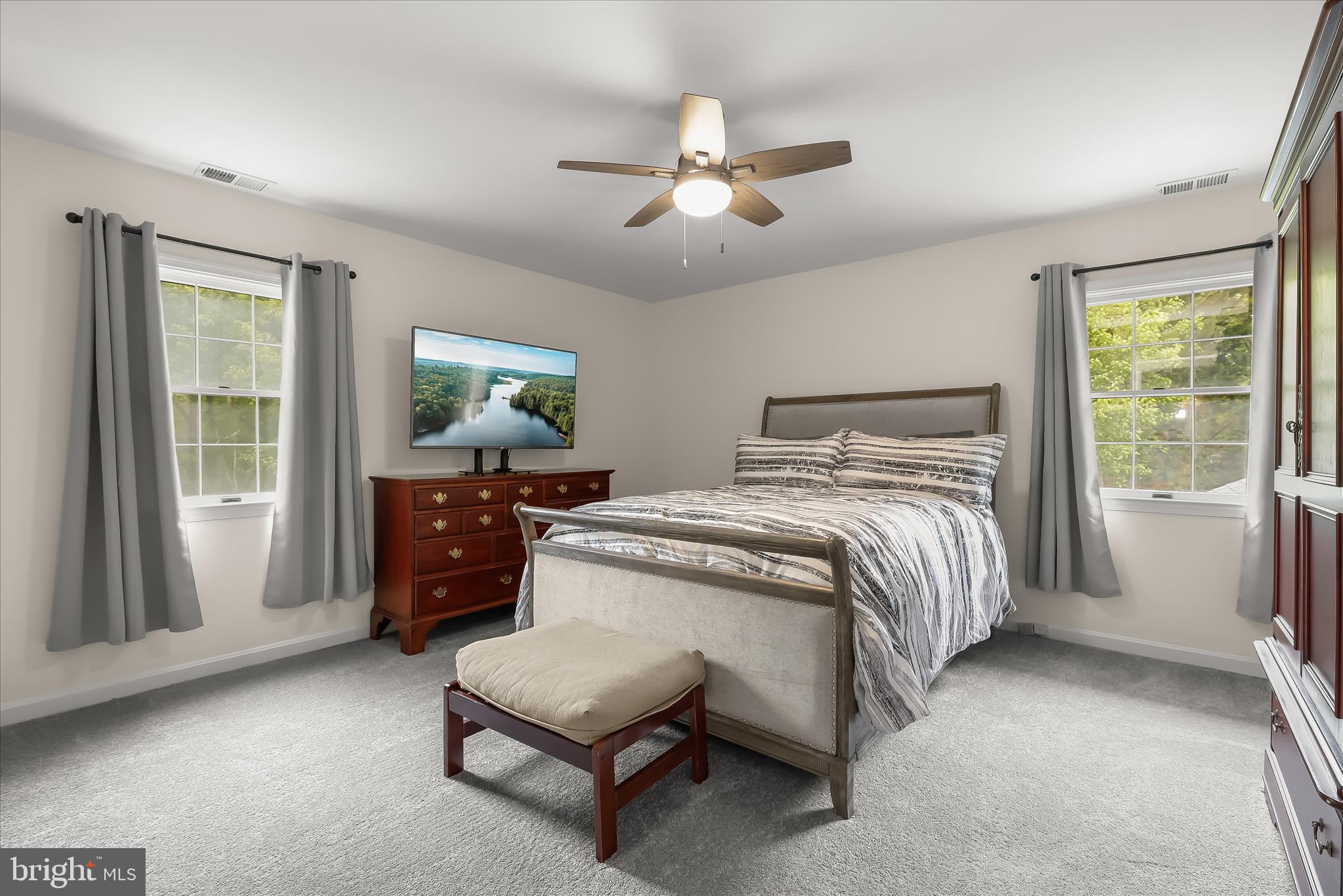 3754 Patuxent River Road Davidsonville, MD 21035 - Photo 43 of 82 a bedroom with a bed and a chandelier
