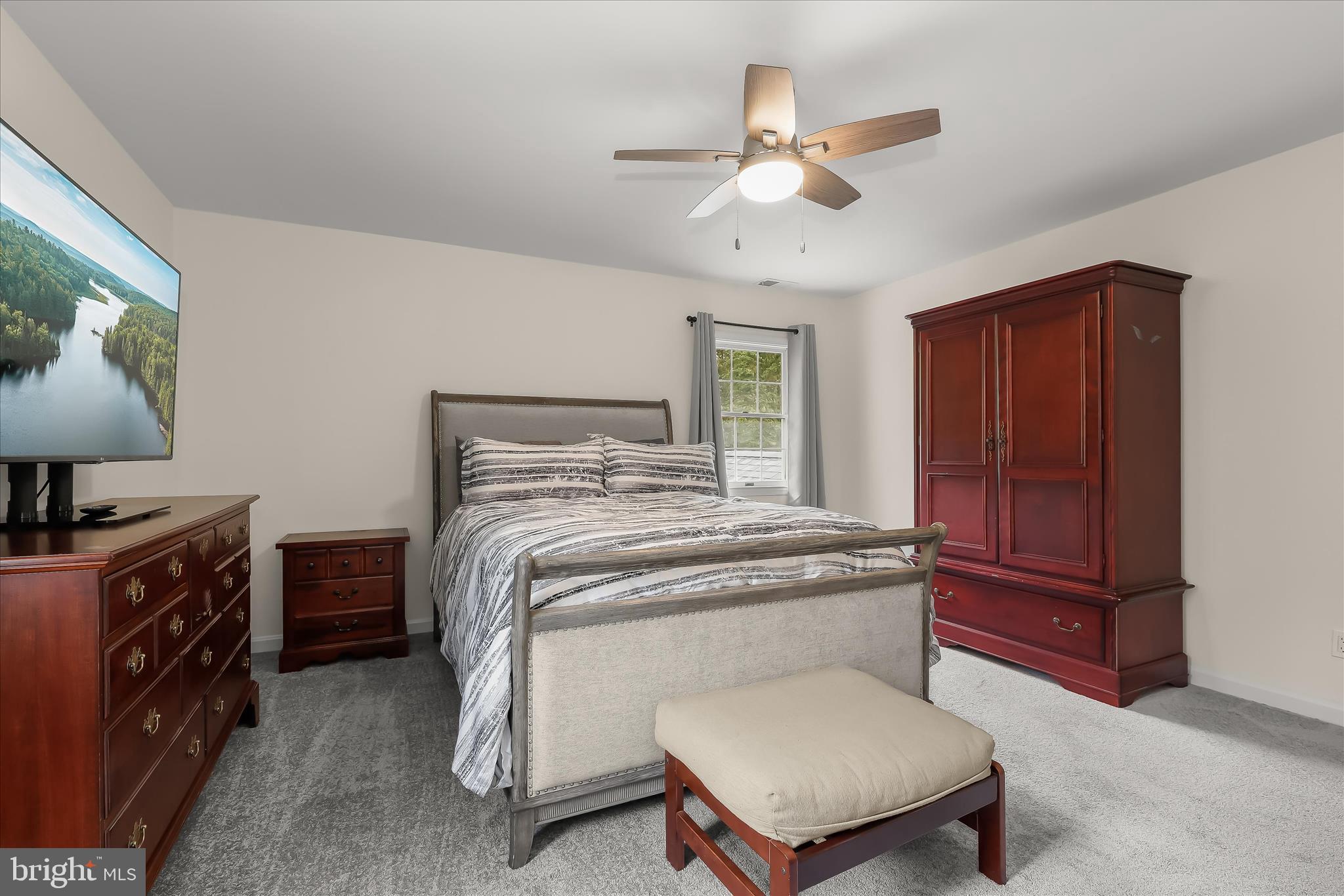 3754 Patuxent River Road Davidsonville, MD 21035 - Photo 44 of 82 a bedroom with a bed dresser and a window