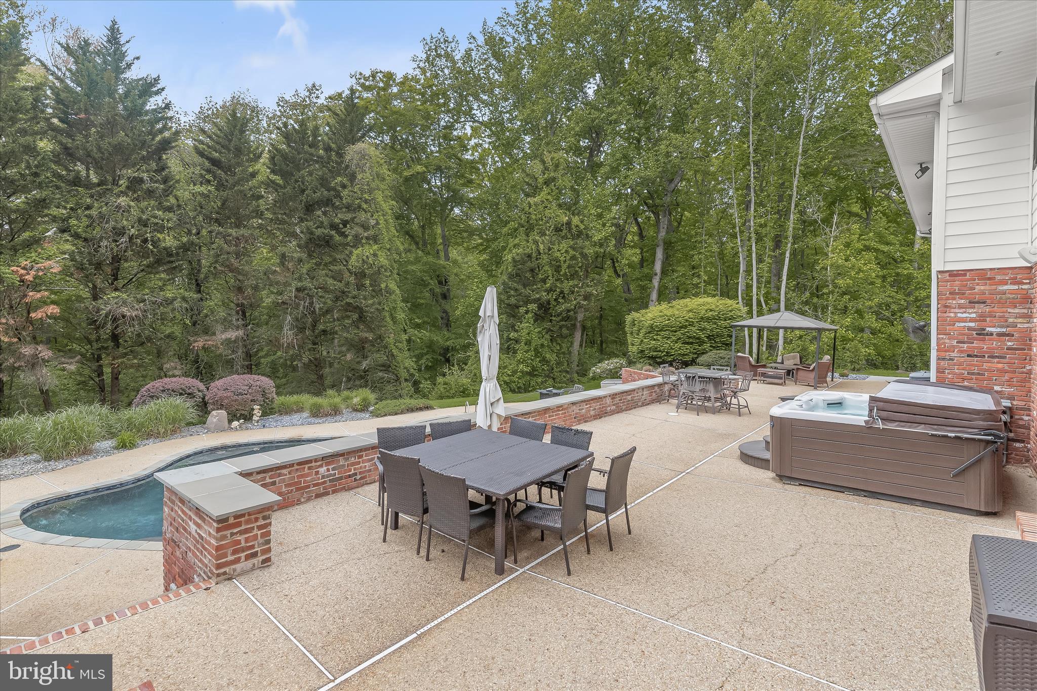 3754 Patuxent River Road Davidsonville, MD 21035 - Photo 63 of 82 a view of a patio with couches and a table and chairs with wooden fence