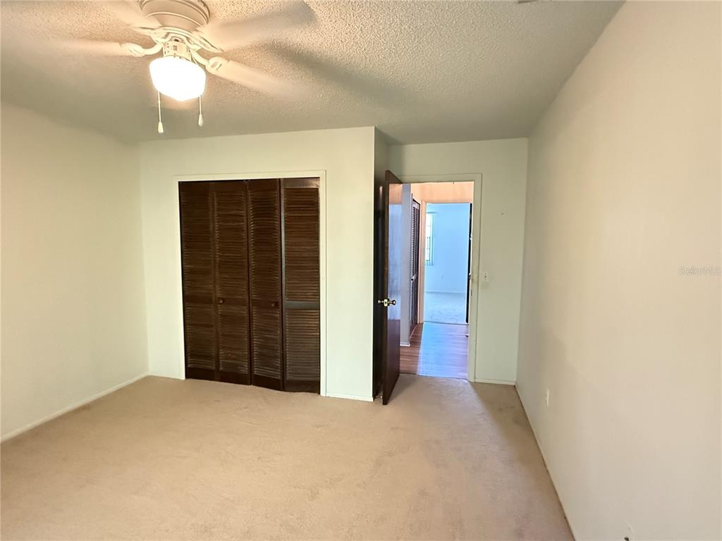 12155 Environmental Drive, Unit 6 New Port Richey, FL 34654 - Photo 17 of 31 a view of empty room with a ceiling fan