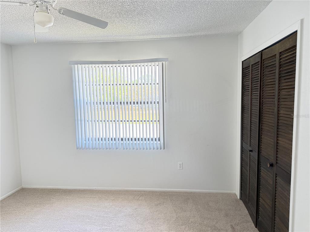 12155 Environmental Drive, Unit 6 New Port Richey, FL 34654 - Photo 18 of 31 a view of an empty room with a window