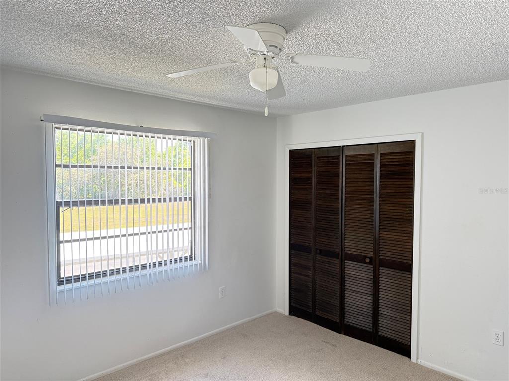 12155 Environmental Drive, Unit 6 New Port Richey, FL 34654 - Photo 19 of 31 a view of an empty room with a window
