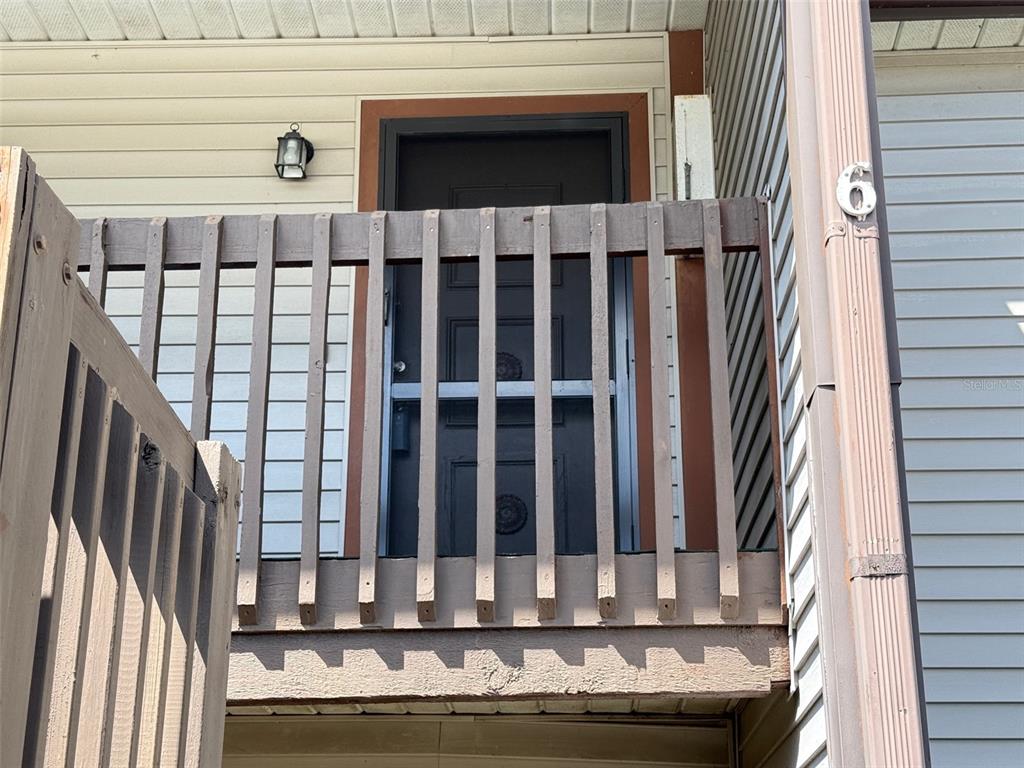 12155 Environmental Drive, Unit 6 New Port Richey, FL 34654 - Photo 2 of 31 a view of wooden balcony
