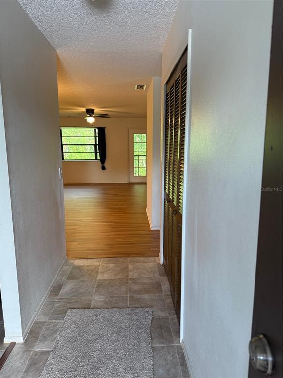 12155 Environmental Drive, Unit 6 New Port Richey, FL 34654 - Photo 7 of 31 a view of hallway with stairs