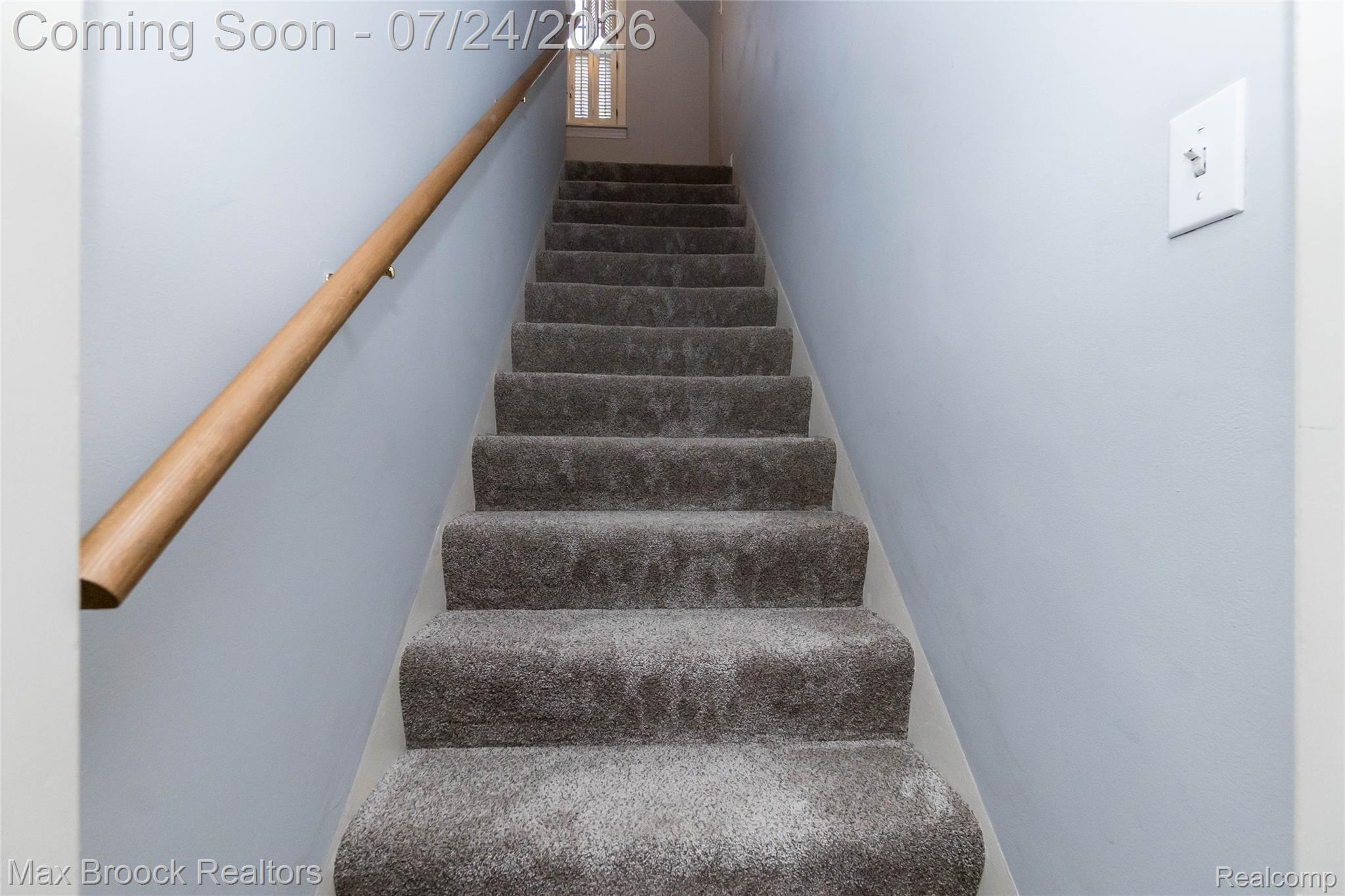 1090 Cambridge Road Berkley, MI 48072 - Photo 17 of 43 Carpeted staircase featuring a light wood-finish handrail and light-toned wall paint