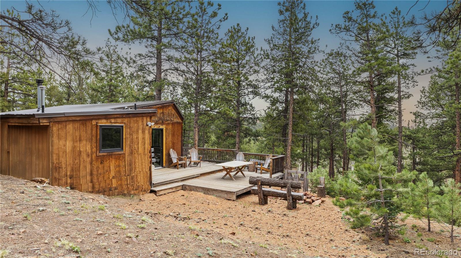 3763 County Road 43 Bailey, CO 80421 - Photo 24 of 40 a view of a backyard with sitting area