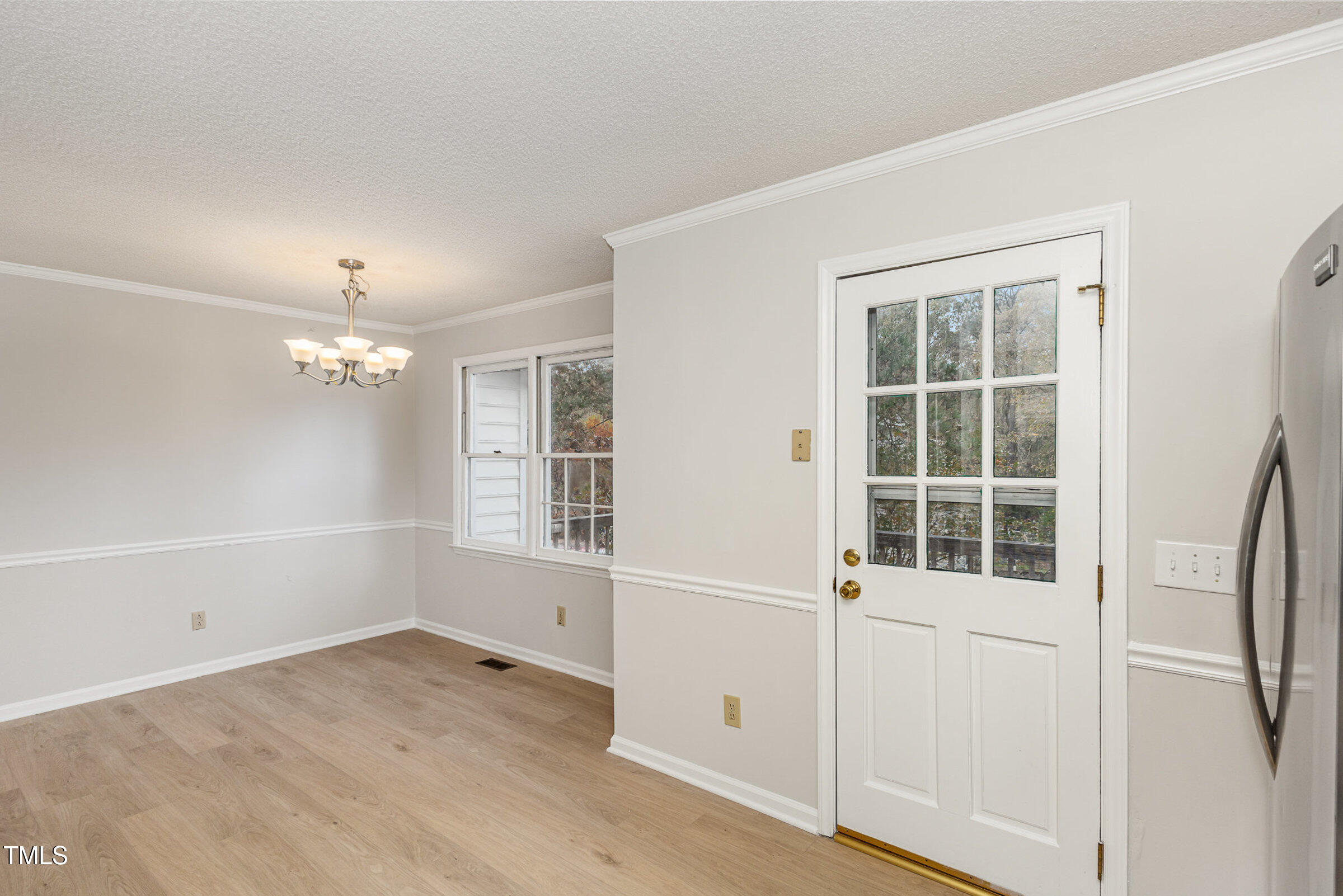 2117 Bufflehead Road Raleigh, NC 27616 - Photo 5 of 27 an empty room with wooden floor and windows