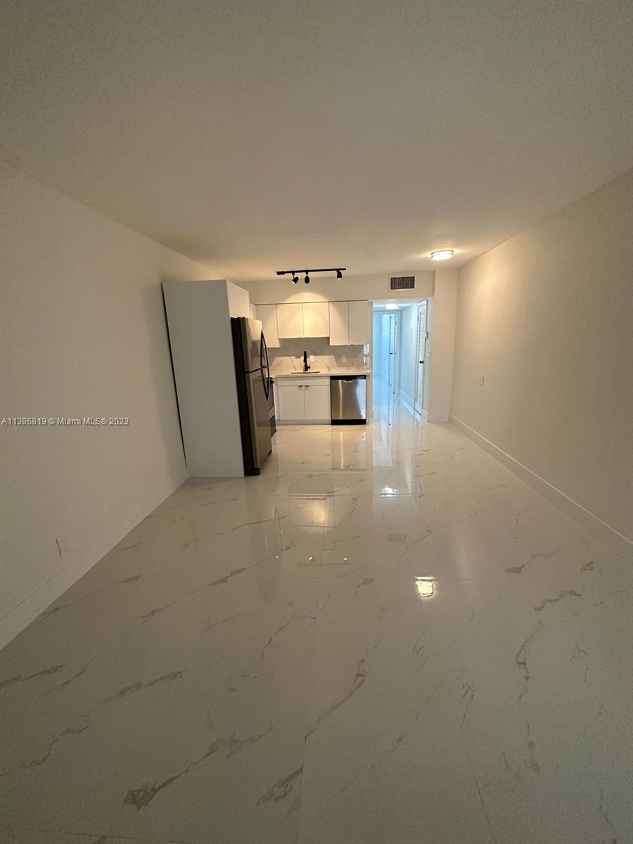 1740 Funston Street, Unit 12 Hollywood, FL 33020 - Photo 3 of 10 a view of a livingroom with furniture and window