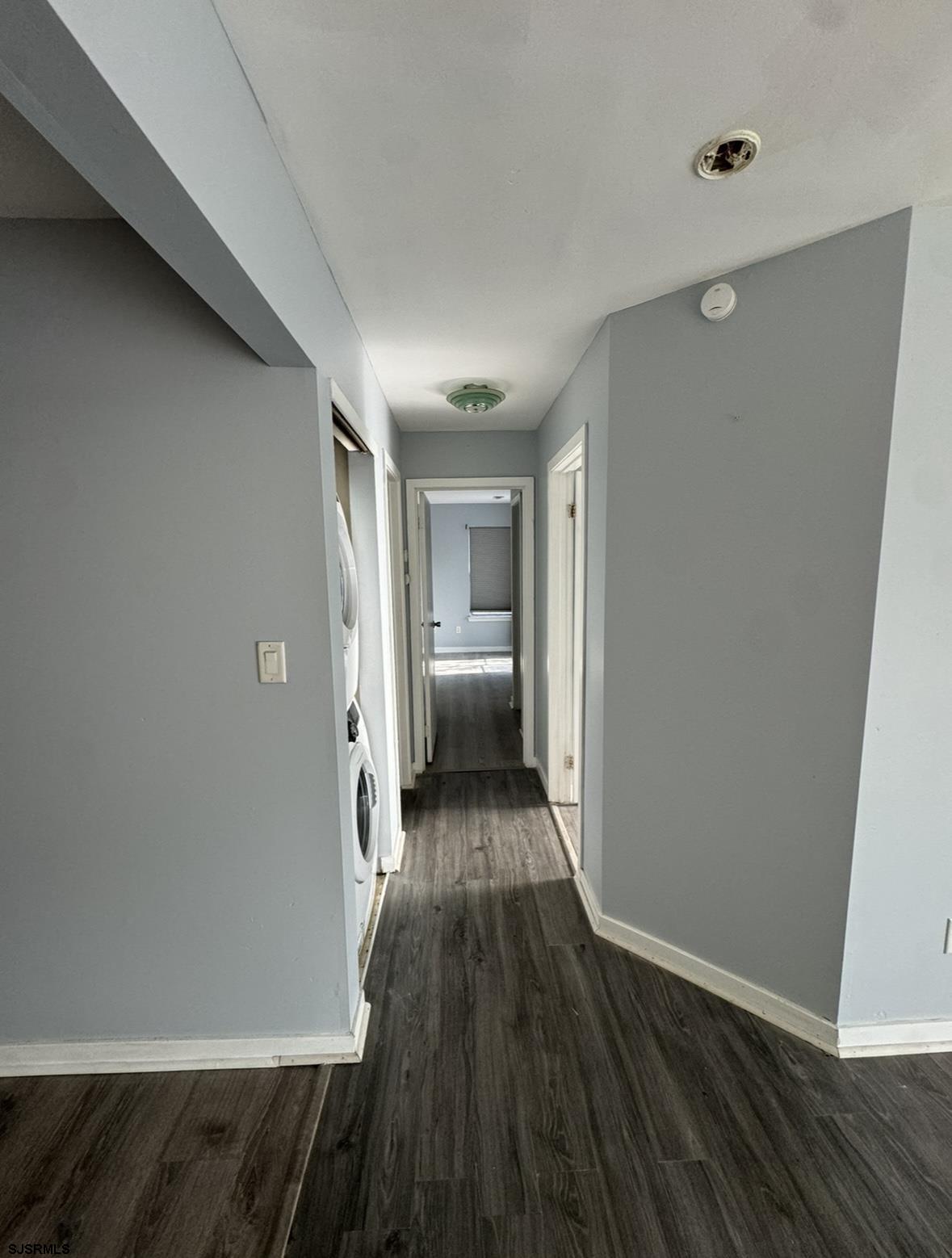 275 Heather Croft, Unit 275 Egg Harbor Township, NJ 08234 - Photo 15 of 23 a view of a hallway with wooden floor and a bathroom