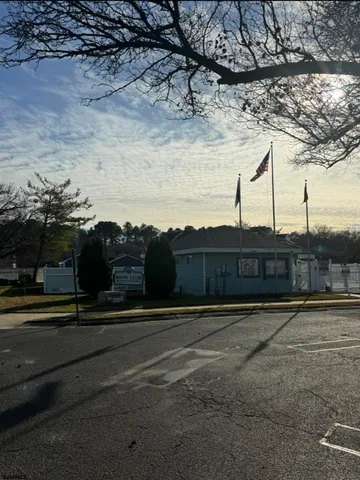 a view of pathway with a building in the background
