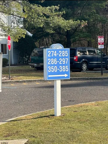 a view of street with parked cars