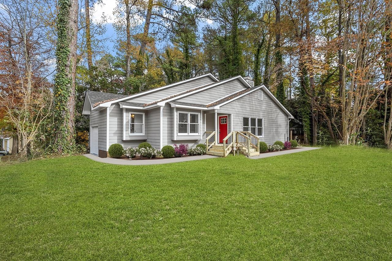 2316 Calvert Drive Raleigh, NC 27610 - Photo 1 of 34 a view of a house with a backyard and patio