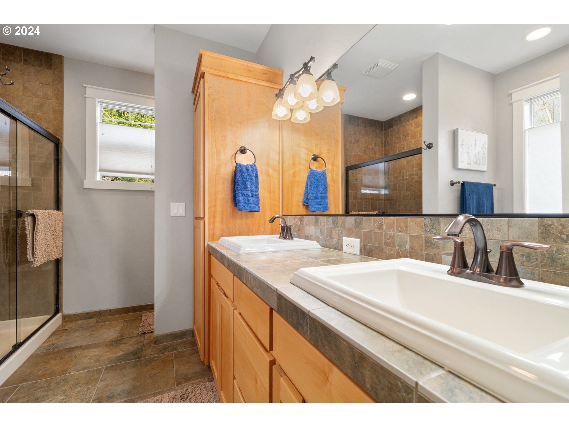 941 Northwest Angel Heights Road Stevenson, WA 98648 - Photo 24 of 38 a bathroom with a sink vanity granite and a mirror
