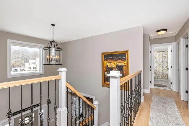a view of a hallway with windows