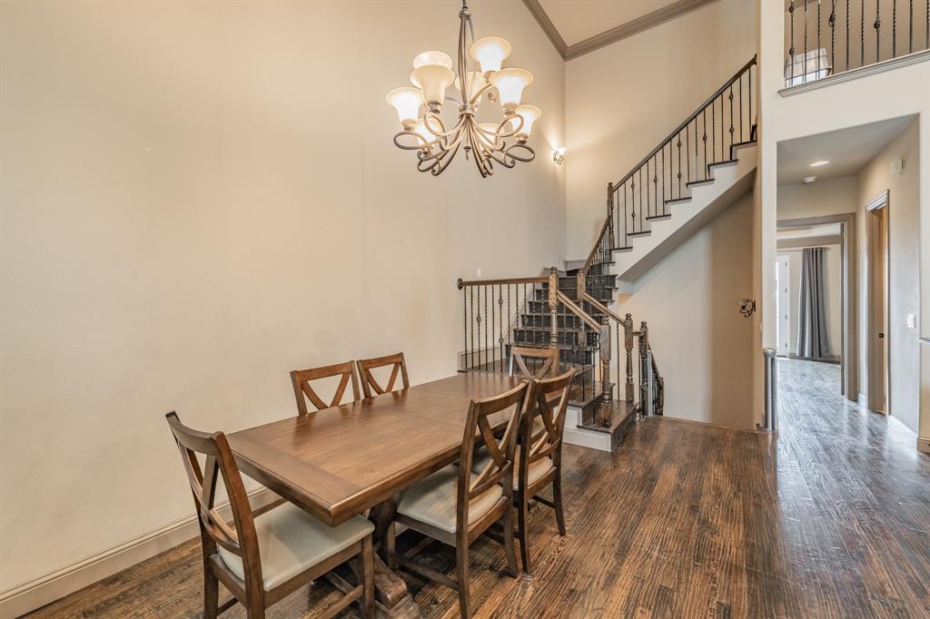 575 Rockingham Drive Irving, TX 75063 - Photo 11 of 38 a view of a dining room with furniture and wooden floor