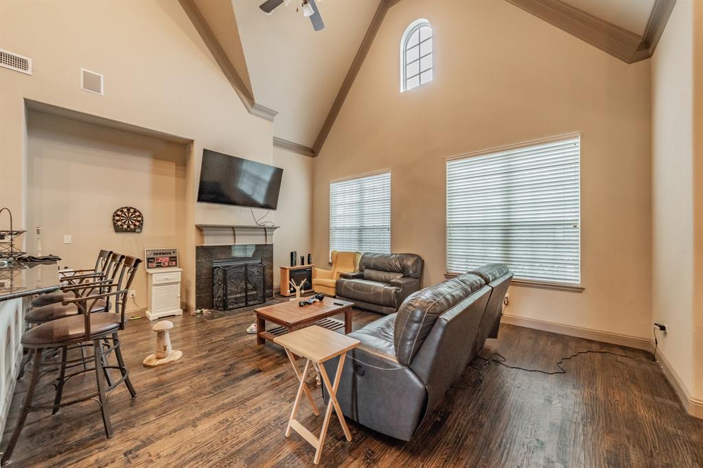 575 Rockingham Drive Irving, TX 75063 - Photo 17 of 38 a living room with fireplace furniture and a flat screen tv