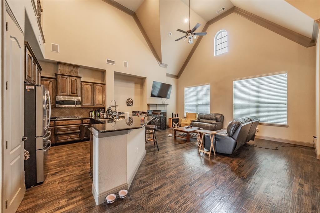 575 Rockingham Drive Irving, TX 75063 - Photo 37 of 38 a living room with stainless steel appliances granite countertop furniture wooden floor and a large window