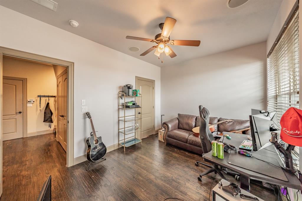 575 Rockingham Drive Irving, TX 75063 - Photo 25 of 38 a living room with furniture and a wooden floor