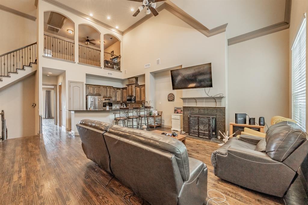 575 Rockingham Drive Irving, TX 75063 - Photo 2 of 38 a living room with furniture and a flat screen tv